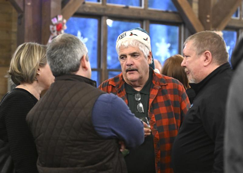 Engaging in a conversation before the festivities are (l-r) Susan Peipher, John Peipher, Walt Lafontaine and Shawn Joynt.
